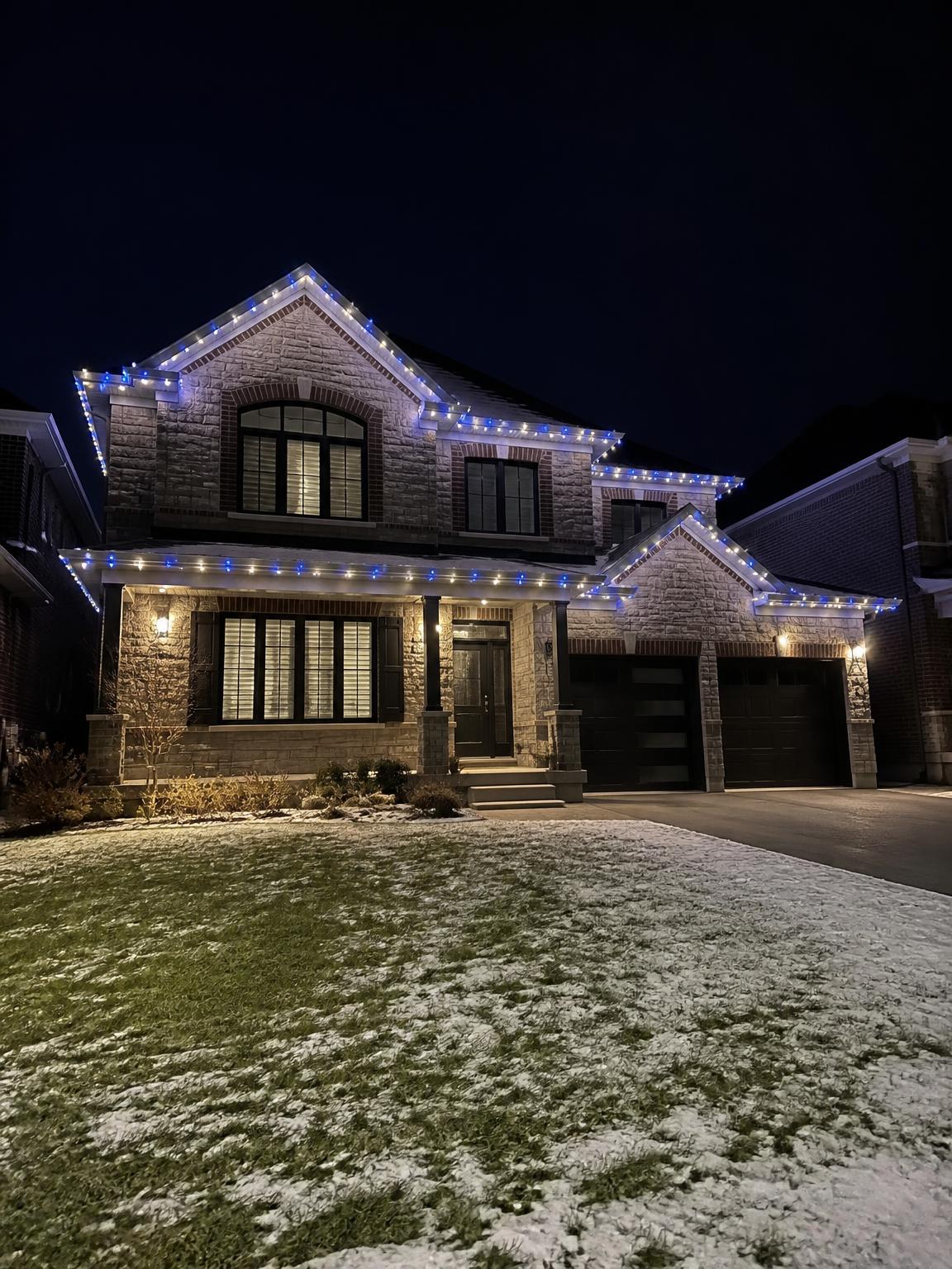 Ontario home with restrained blue and warm white roofline lights